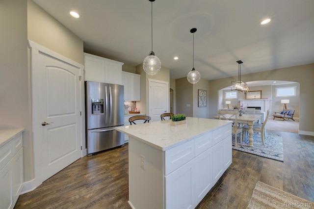 MOH45 Birkdale Dr Unit 45, Howell, MI 48843 - kitchen with stainless steel fridge with ice dispenser, a center island, dark wood-type flooring, arched walkways, and recessed lighting