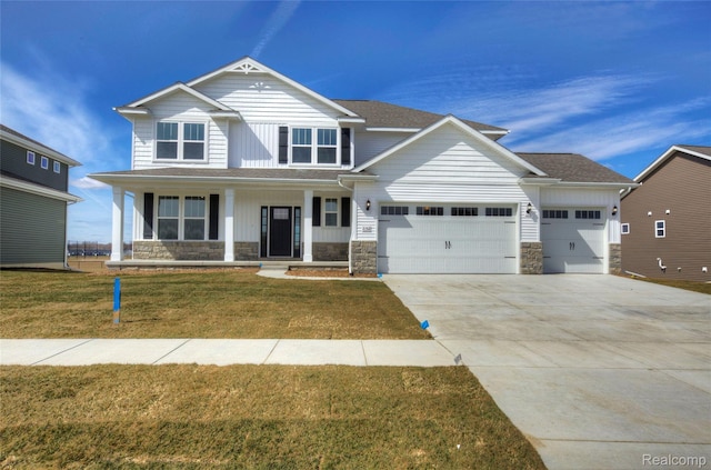 MOH45 Birkdale Dr Unit 45, Howell, MI 48843 - craftsman house with stone siding, a garage, covered porch, driveway, and a front lawn