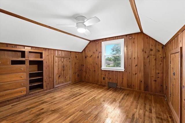 21197 Nummer St, Warren, MI 48089 - additional living space with vaulted ceiling, hardwood / wood-style flooring, wood walls, and a ceiling fan
