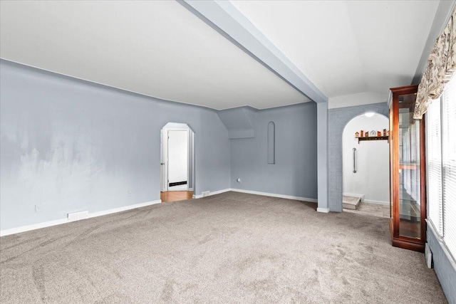 21197 Nummer St, Warren, MI 48089 - unfurnished living room with arched walkways and carpet flooring