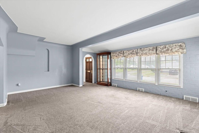 21197 Nummer St, Warren, MI 48089 - carpeted empty room with arched walkways and baseboards