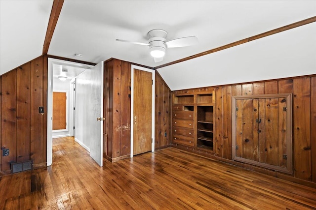 21197 Nummer St, Warren, MI 48089 - bonus room featuring lofted ceiling, wooden walls, ceiling fan, and wood finished floors