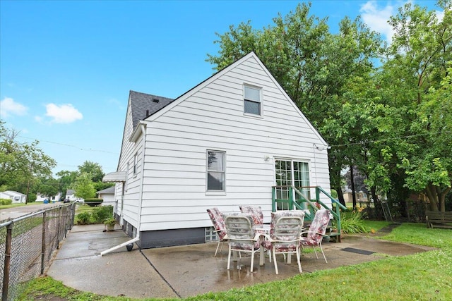 21197 Nummer St, Warren, MI 48089 - back of property with a patio and roof with shingles