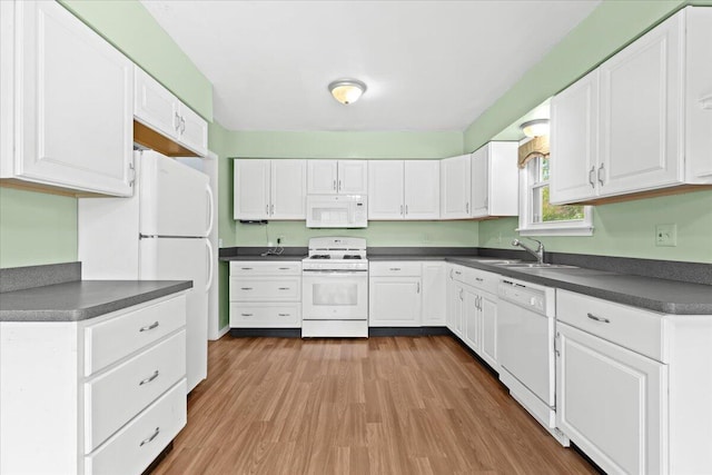 21197 Nummer St, Warren, MI 48089 - kitchen with white appliances, dark countertops, and wood finished floors