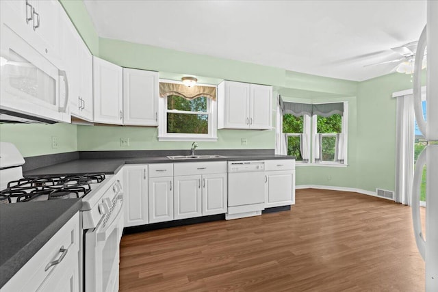 21197 Nummer St, Warren, MI 48089 - kitchen featuring white appliances, dark countertops, white cabinetry, and dark wood-style flooring