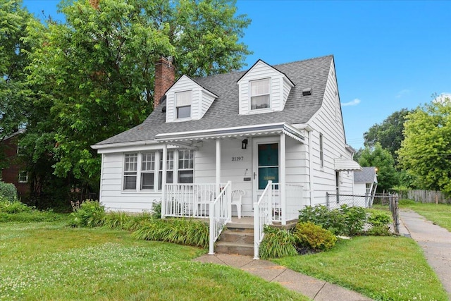 21197 Nummer St, Warren, MI 48089 - new england style home featuring a chimney, covered porch, and roof with shingles
