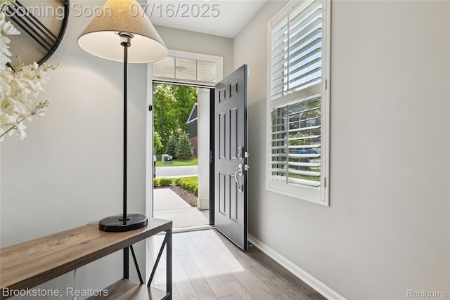 765 Hummingbird Dr, Rochester Hills, MI 48307 - entryway with wood finished floors and baseboards