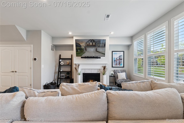 765 Hummingbird Dr, Rochester Hills, MI 48307 - living room featuring a lit fireplace and recessed lighting