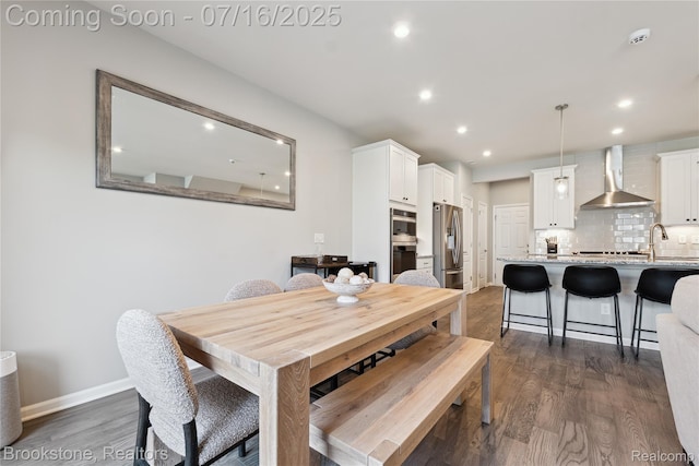 765 Hummingbird Dr, Rochester Hills, MI 48307 - dining area with dark wood-style flooring and recessed lighting