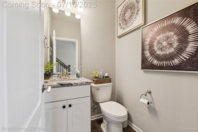 765 Hummingbird Dr, Rochester Hills, MI 48307 - half bathroom featuring toilet and vanity