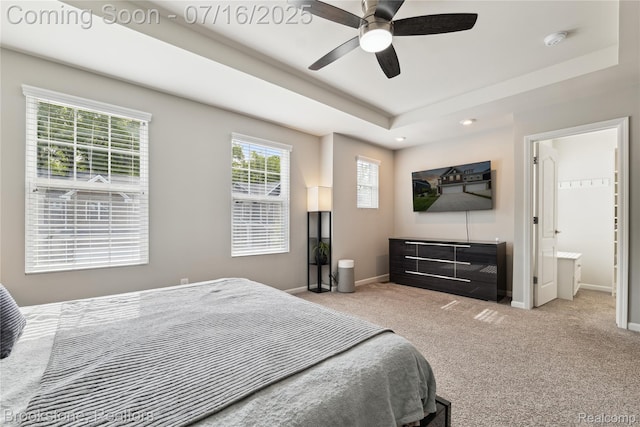 765 Hummingbird Dr, Rochester Hills, MI 48307 - carpeted bedroom featuring a tray ceiling, recessed lighting, ensuite bath, and ceiling fan