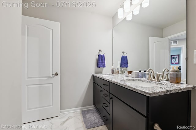 765 Hummingbird Dr, Rochester Hills, MI 48307 - full bath featuring double vanity and marble finish floors