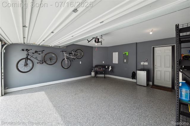 765 Hummingbird Dr, Rochester Hills, MI 48307 - garage with a garage door opener and electric panel