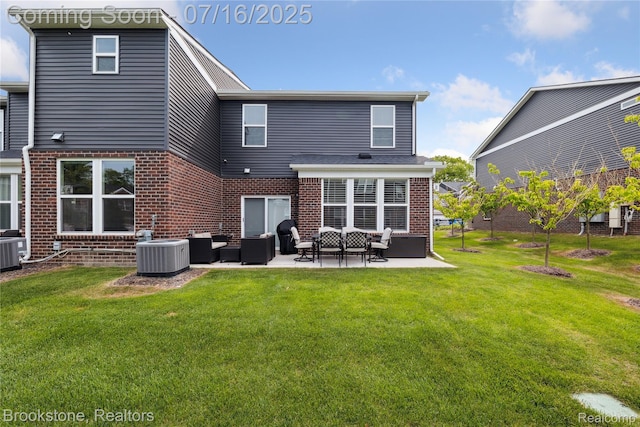 765 Hummingbird Dr, Rochester Hills, MI 48307 - back of house with an outdoor hangout area, brick siding, a patio, and a yard