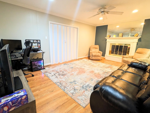 20519 Mauer St, Saint Clair Shores, MI 48080 - living room with wood finished floors, a desk, a ceiling fan, ornamental molding, and a glass covered fireplace