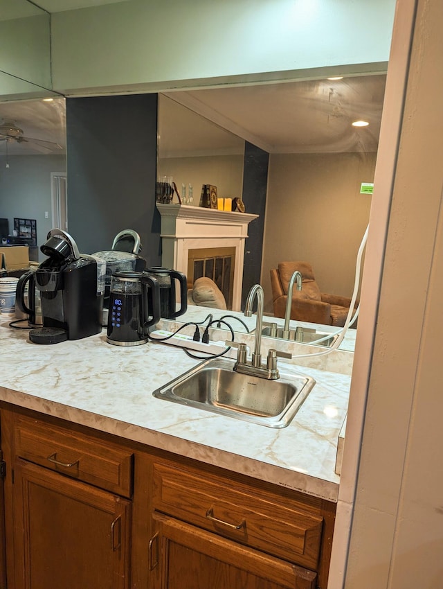 20519 Mauer St, Saint Clair Shores, MI 48080 - kitchen featuring light countertops, brown cabinetry, open floor plan, and ceiling fan