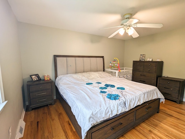20519 Mauer St, Saint Clair Shores, MI 48080 - bedroom with light wood-type flooring and ceiling fan