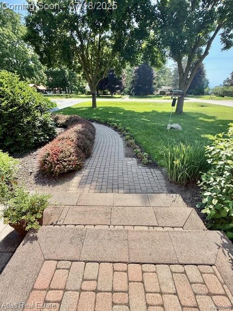 8354 Ridge Rd, Goodrich, MI 48438 - view of home's community with a lawn