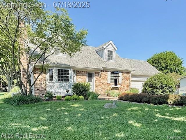 8354 Ridge Rd, Goodrich, MI 48438 - cape cod home with an attached garage, a front lawn, brick siding, and roof with shingles