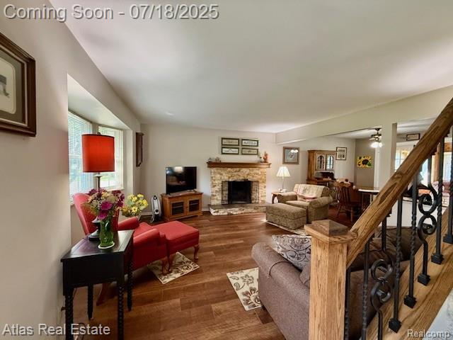 8354 Ridge Rd, Goodrich, MI 48438 - living room featuring wood finished floors and a fireplace