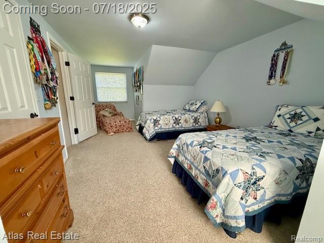 8354 Ridge Rd, Goodrich, MI 48438 - carpeted bedroom with vaulted ceiling