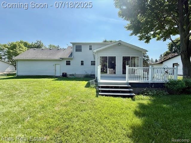 8354 Ridge Rd, Goodrich, MI 48438 - rear view of property with a wooden deck and a yard