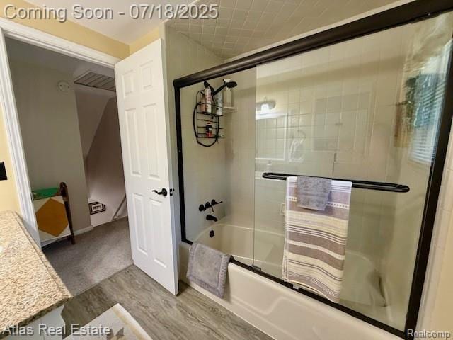 8354 Ridge Rd, Goodrich, MI 48438 - bathroom featuring wood finished floors, combined bath / shower with glass door, and vanity