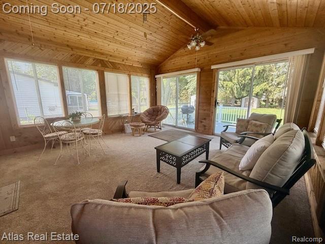 8354 Ridge Rd, Goodrich, MI 48438 - living room with wooden walls, wooden ceiling, carpet flooring, and ceiling fan