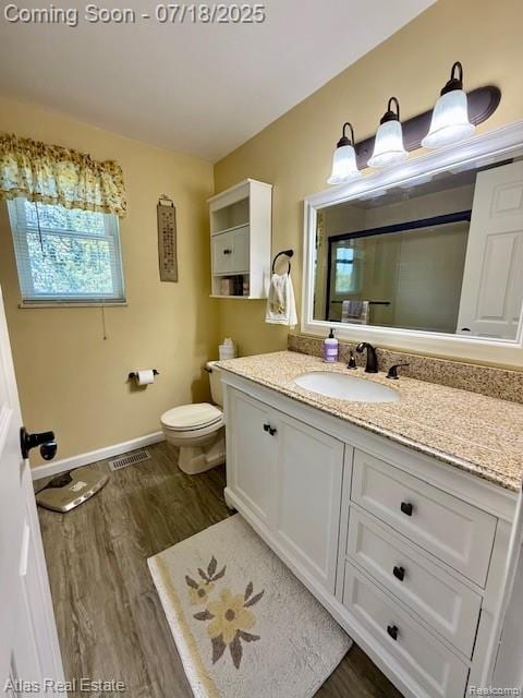 8354 Ridge Rd, Goodrich, MI 48438 - full bath with vanity, wood finished floors, and a shower