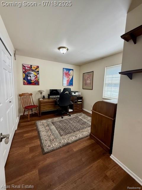 8354 Ridge Rd, Goodrich, MI 48438 - office with dark wood-style floors and baseboards
