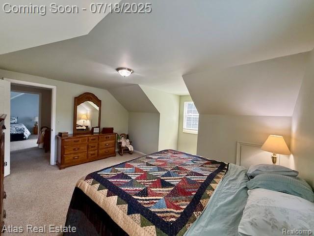8354 Ridge Rd, Goodrich, MI 48438 - carpeted bedroom featuring vaulted ceiling