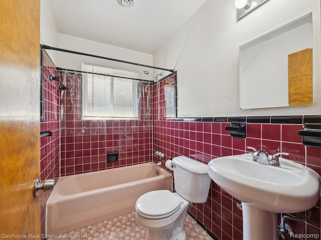 1010 Laprairie St, Ferndale, MI 48220 - bathroom featuring tub / shower combination, tile walls, and wainscoting