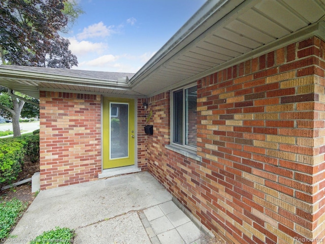 1010 Laprairie St, Ferndale, MI 48220 - entrance to property featuring brick siding and roof with shingles