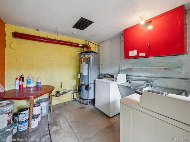 1010 Laprairie St, Ferndale, MI 48220 - laundry area with gas water heater, washer / dryer, concrete block wall, and cabinet space
