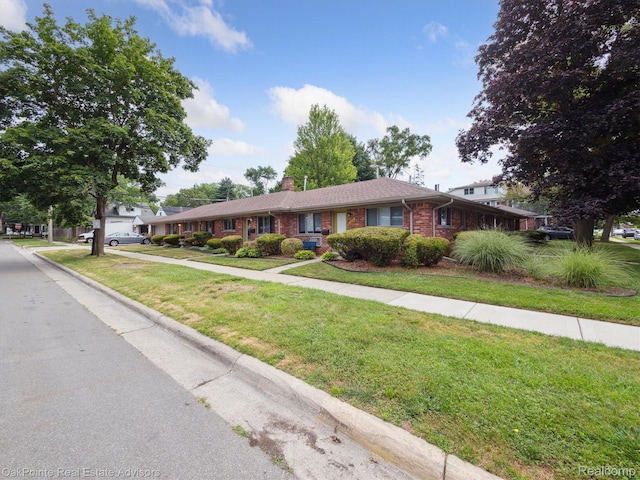 1010 Laprairie St, Ferndale, MI 48220 - single story home featuring a chimney, brick siding, and a front yard