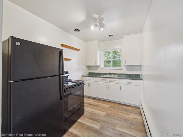 1010 Laprairie St, Ferndale, MI 48220 - kitchen with black appliances, white cabinets, a baseboard radiator, and light wood-style flooring