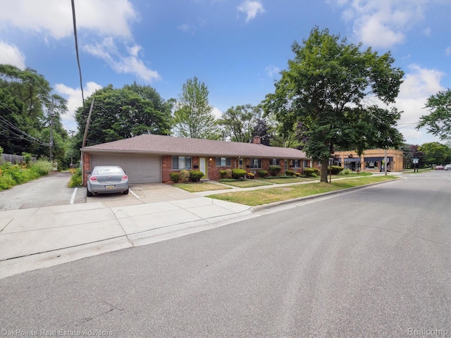 1010 Laprairie St, Ferndale, MI 48220 - single story home with an attached garage, brick siding, concrete driveway, a chimney, and a front yard