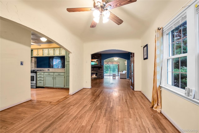 3870 Benstein Rd, Commerce Twp, MI 48382 - corridor with arched walkways and light wood finished floors