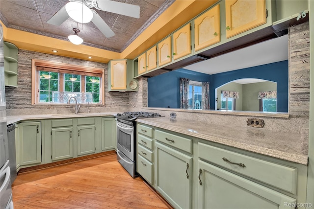 3870 Benstein Rd, Commerce Twp, MI 48382 - kitchen with green cabinets, stainless steel range with gas cooktop, plenty of natural light, light wood-type flooring, and an ornate ceiling