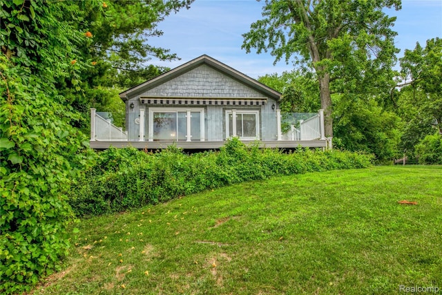 3870 Benstein Rd, Commerce Twp, MI 48382 - rear view of property featuring a wooden deck and a yard