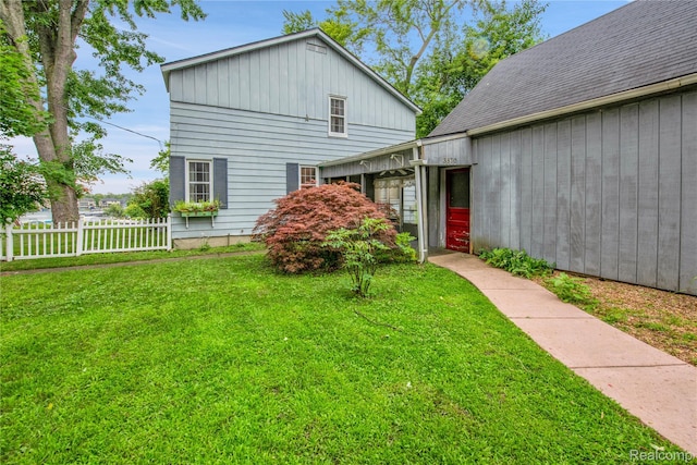 3870 Benstein Rd, Commerce Twp, MI 48382 - view of front of home with board and batten siding