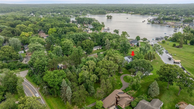 3870 Benstein Rd, Commerce Twp, MI 48382 - aerial view of property and surrounding area featuring a nearby body of water and a heavily wooded area