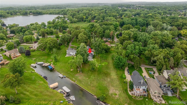 3870 Benstein Rd, Commerce Twp, MI 48382 - aerial view of property and surrounding area featuring a nearby body of water and a forest
