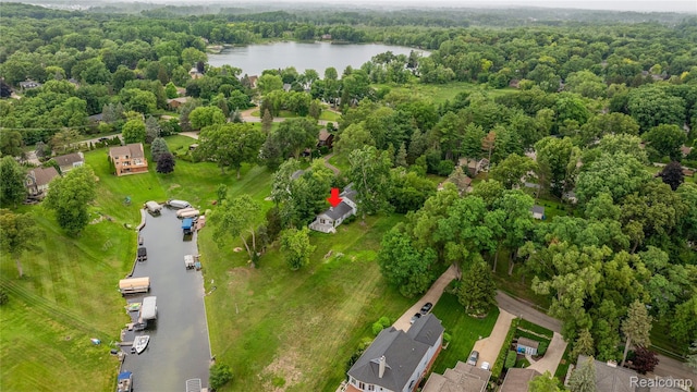 3870 Benstein Rd, Commerce Twp, MI 48382 - drone / aerial view of a nearby body of water and a heavily wooded area