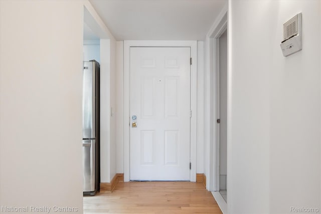 3559 Port Cove Dr Unit 17, Waterford, MI 48328 - hall with light wood-style floors and baseboards