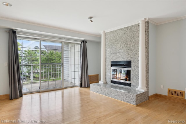 3559 Port Cove Dr Unit 17, Waterford, MI 48328 - unfurnished living room with ornamental molding, wood finished floors, and a multi sided fireplace