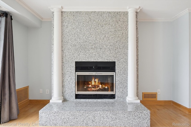 3559 Port Cove Dr Unit 17, Waterford, MI 48328 - detailed view of crown molding, wood finished floors, and a premium fireplace