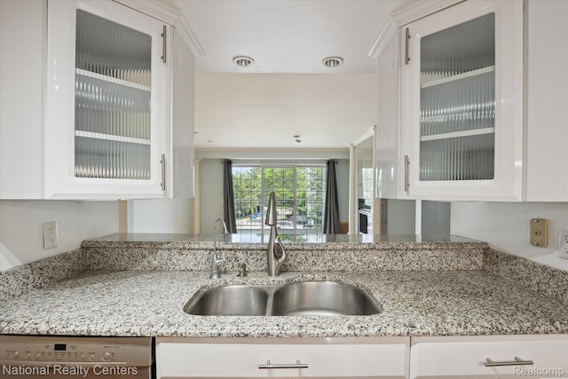 3559 Port Cove Dr Unit 17, Waterford, MI 48328 - kitchen featuring stainless steel dishwasher, white cabinetry, and light stone counters