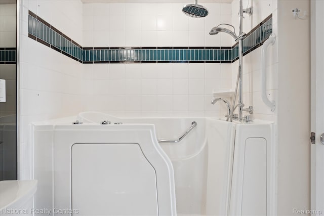 3559 Port Cove Dr Unit 17, Waterford, MI 48328 - bathroom with a garden tub, tile walls, and a shower
