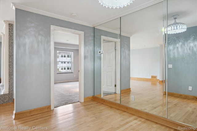 3559 Port Cove Dr Unit 17, Waterford, MI 48328 - hallway featuring wood finished floors and crown molding